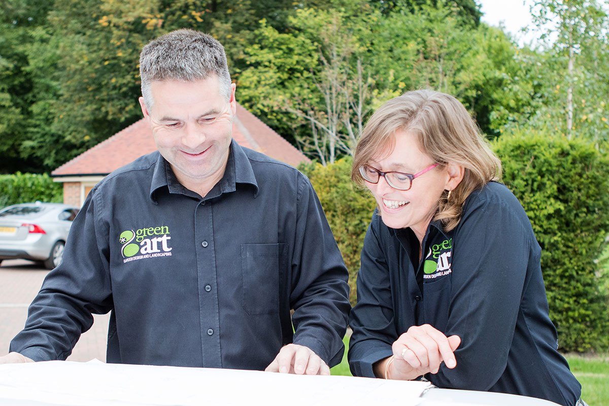 George & Jo looking at plans outside on GreenArt van.