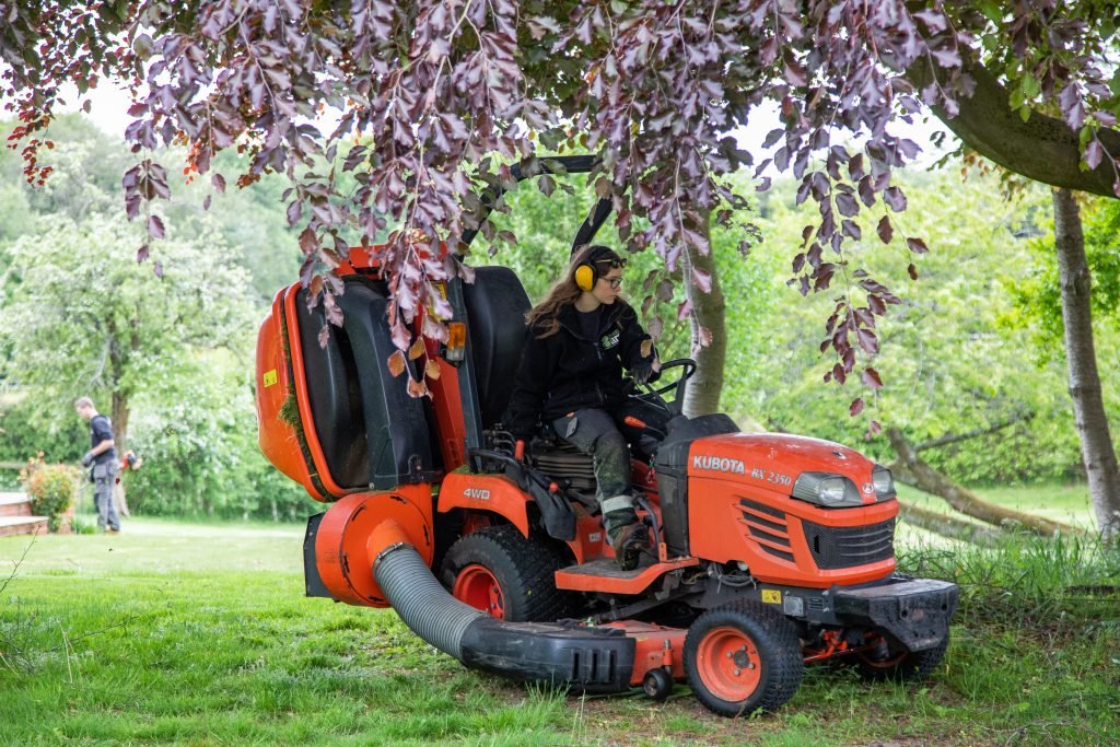 Sasha, our Landscape Gardening Supervisor, on the ride on mower.