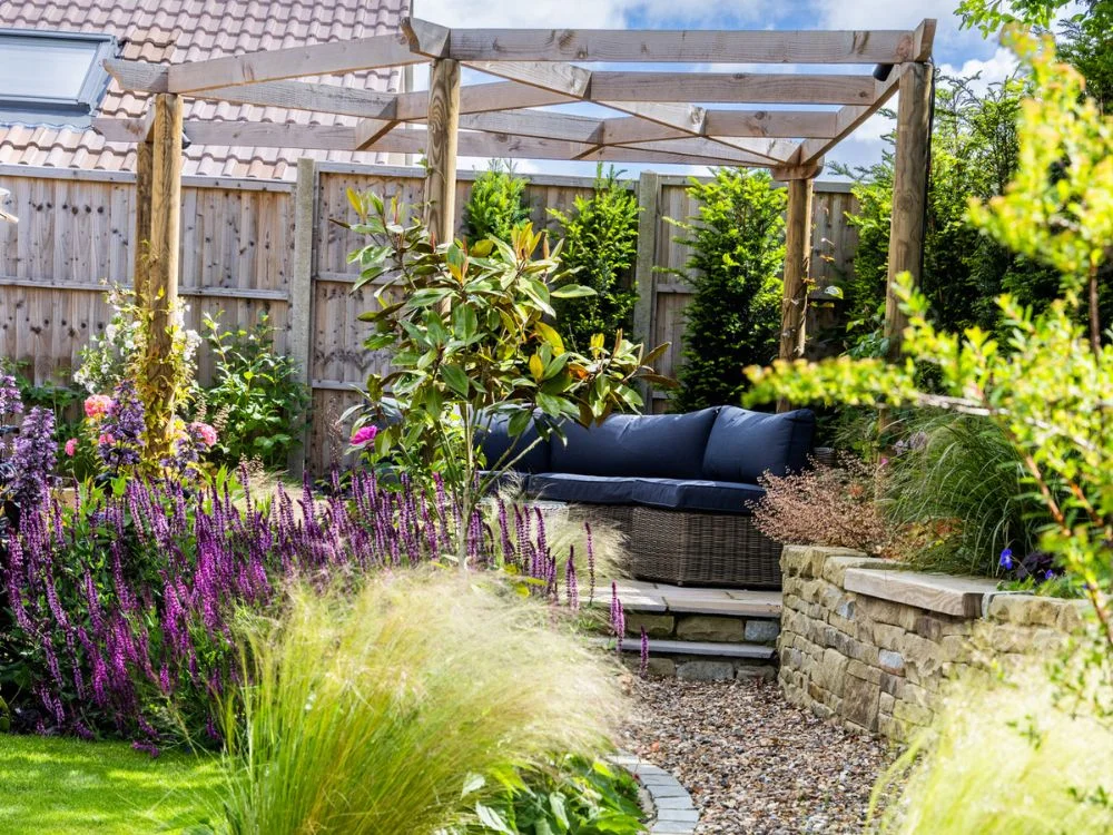 Pergolas in garden with seating
