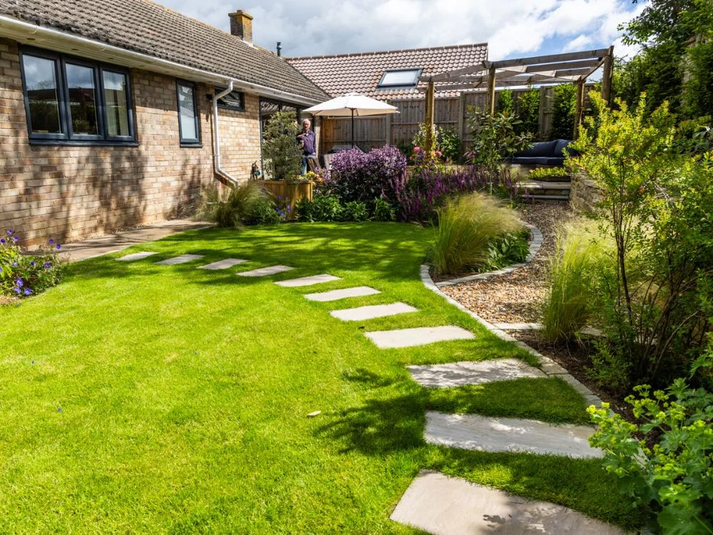 Steps on grass leading to house